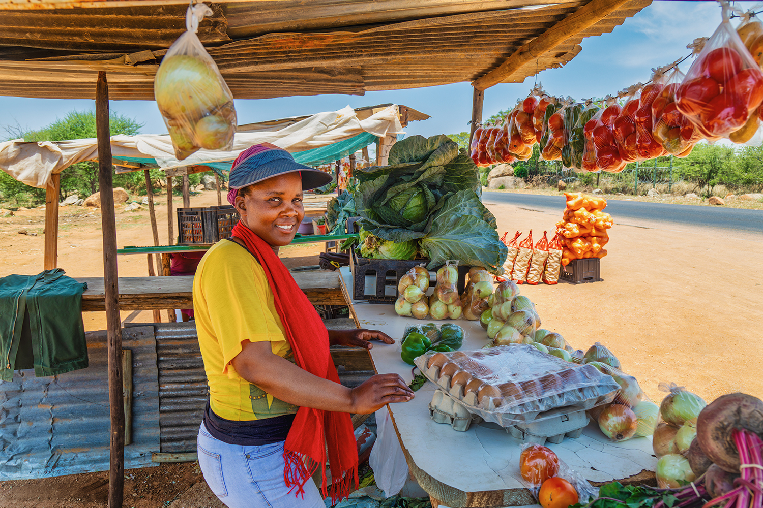 Woman street vendor selling eggs and other products