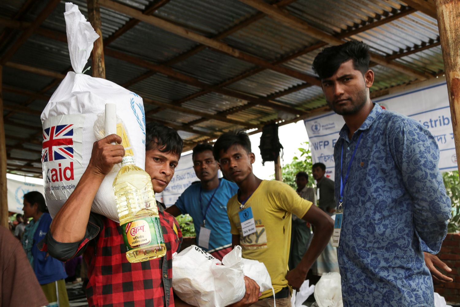 Food parcels funded by UK aid being distributed by the World Food Programme to Rohingya refugees in the Kutupalong camp