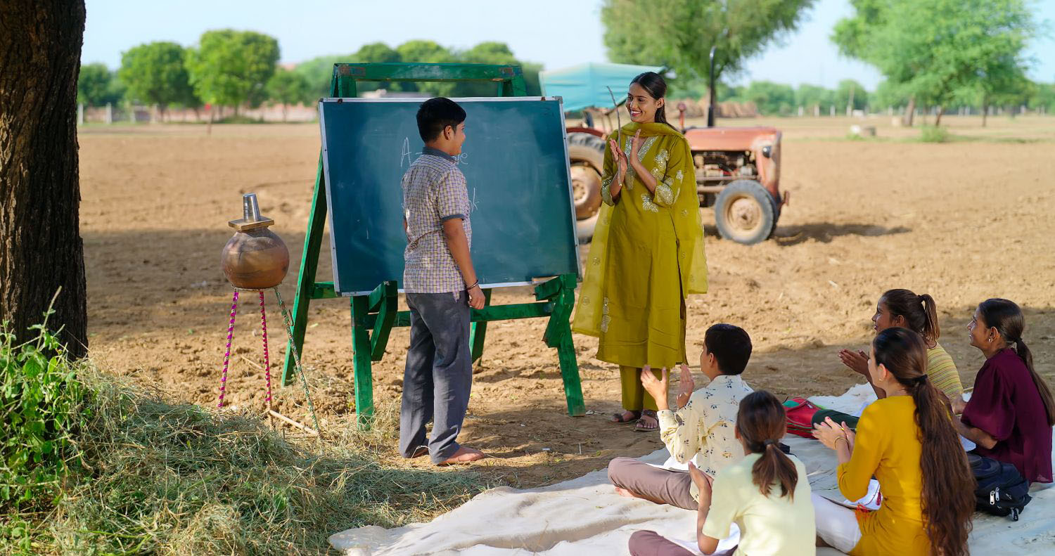 Students in a remote area attending a school lesson outdoors