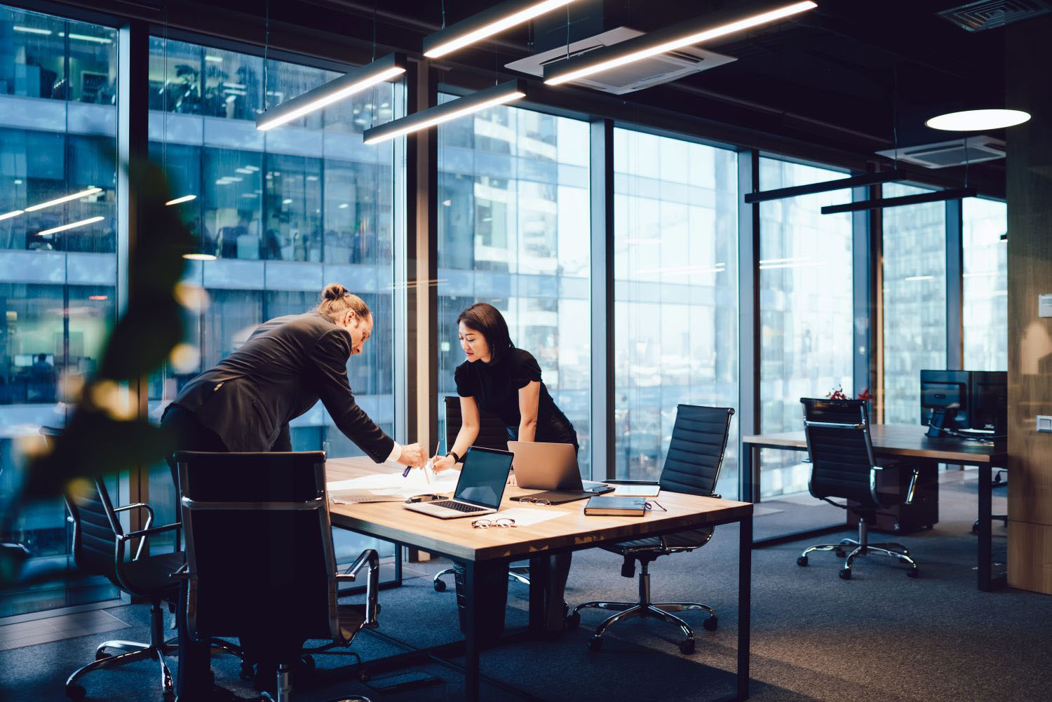 Male and female coworkers interacting in an office 