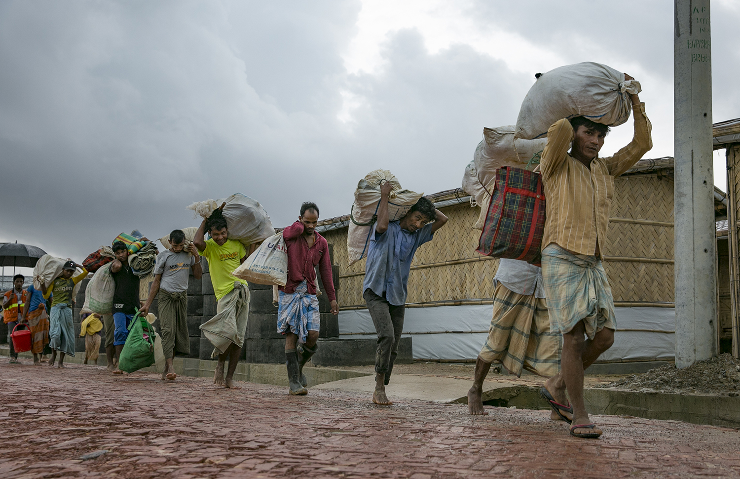 Families being relocated due to flooding and landslides in a refugee camp in Bangladesh
