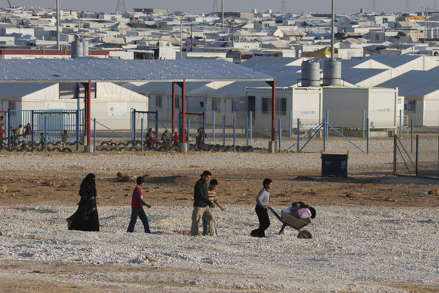 Children earn a living by transporting goods inside the Zaatari Refugee Camp, Jordan