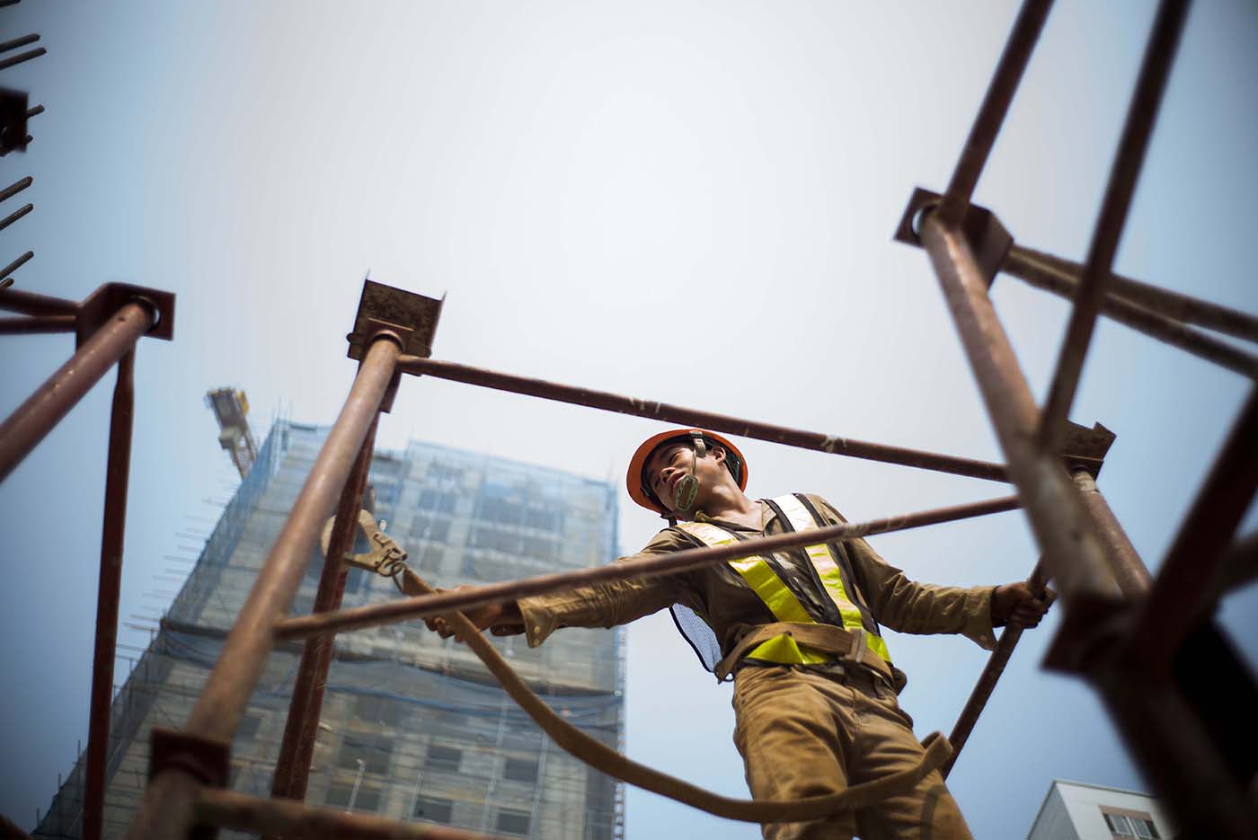 Construction workers at building site in Vietnam