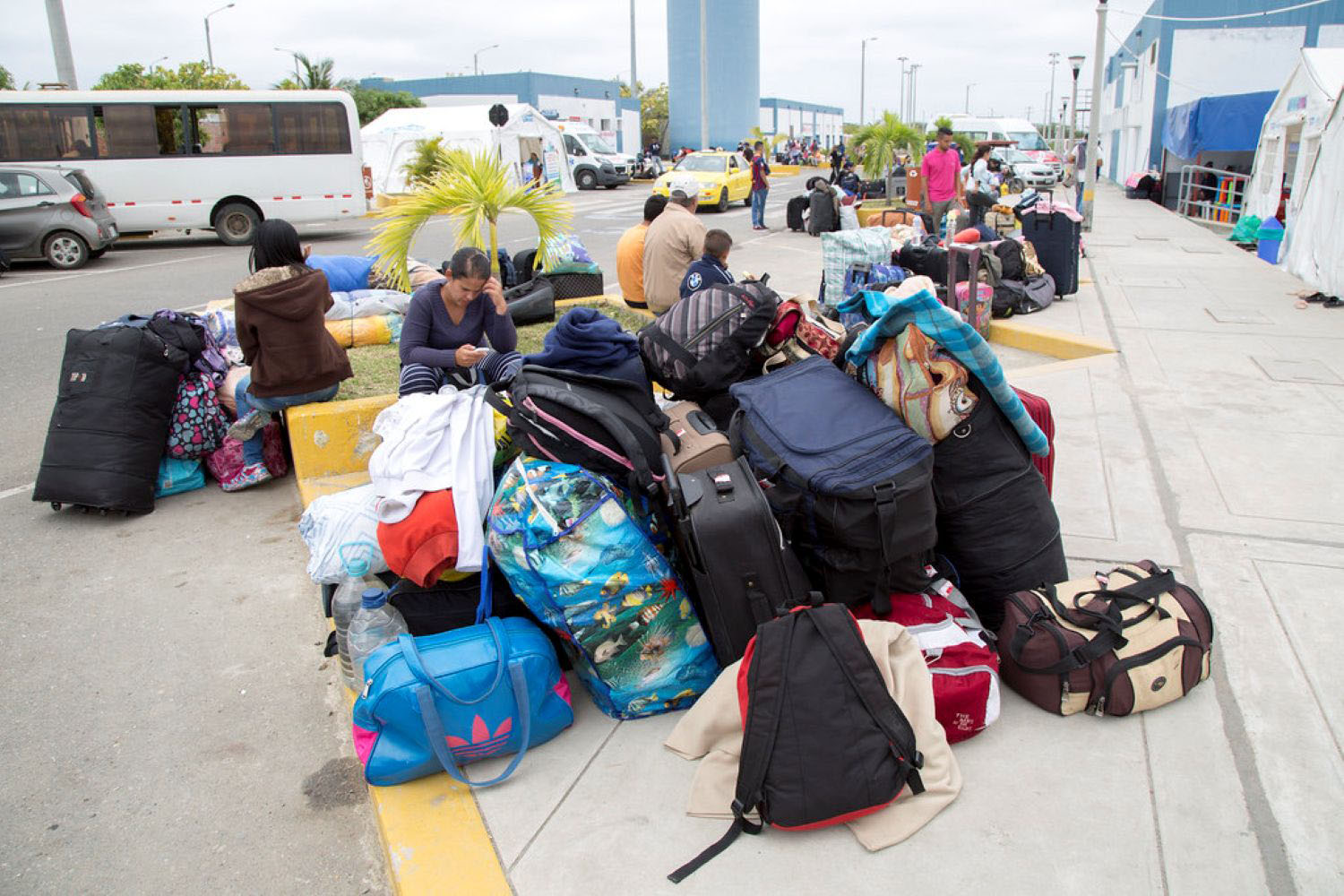 Image of a group of Venezuelans waiting at the border to cross into Peru on October 9, 2018 in Tumbes, Peru. 