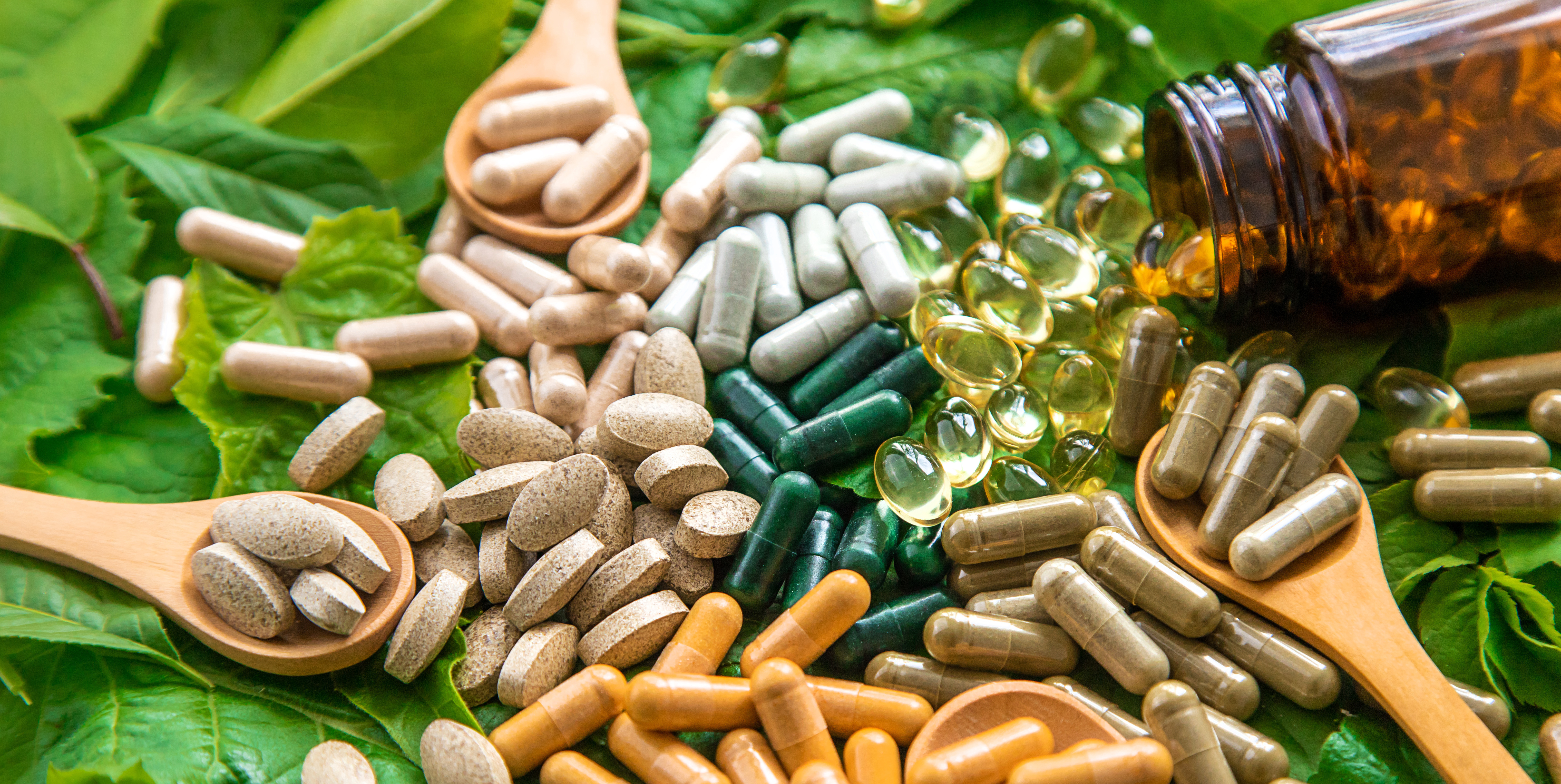 Health supplements pill spread on a green background