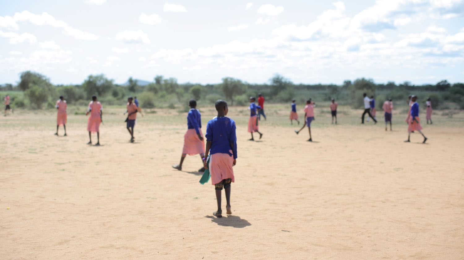 Female children playing outside on school grounds