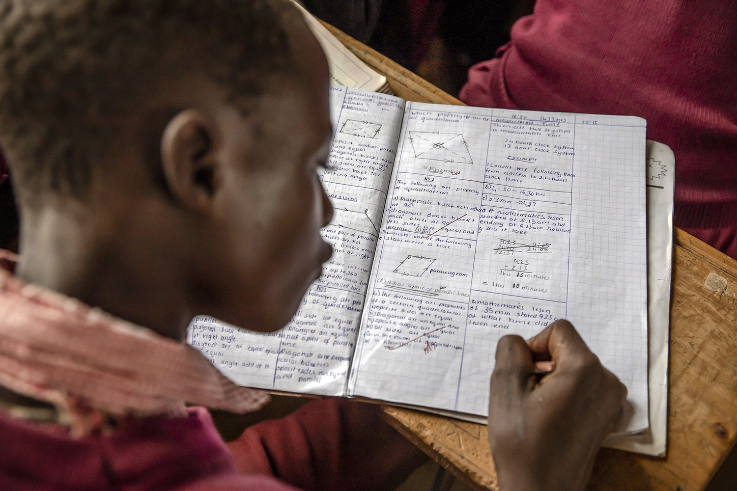 A student writes in his notebook