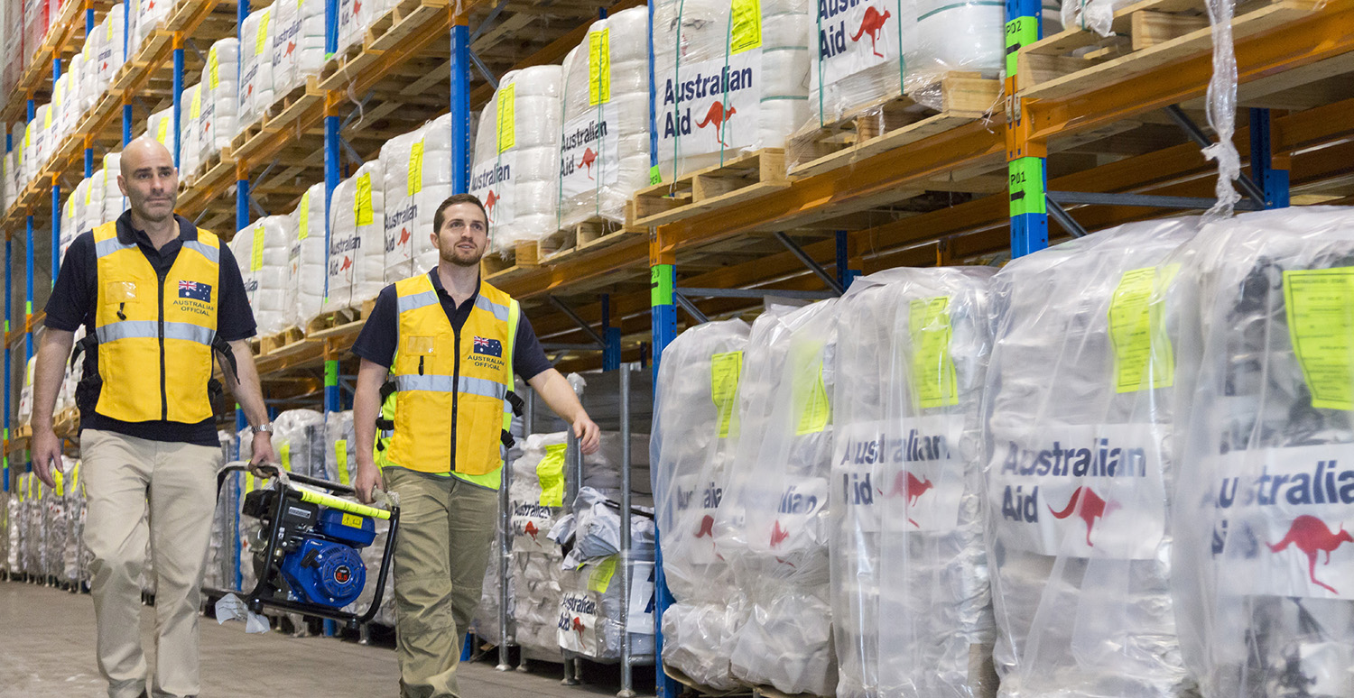 Australian aid workers in warehouse