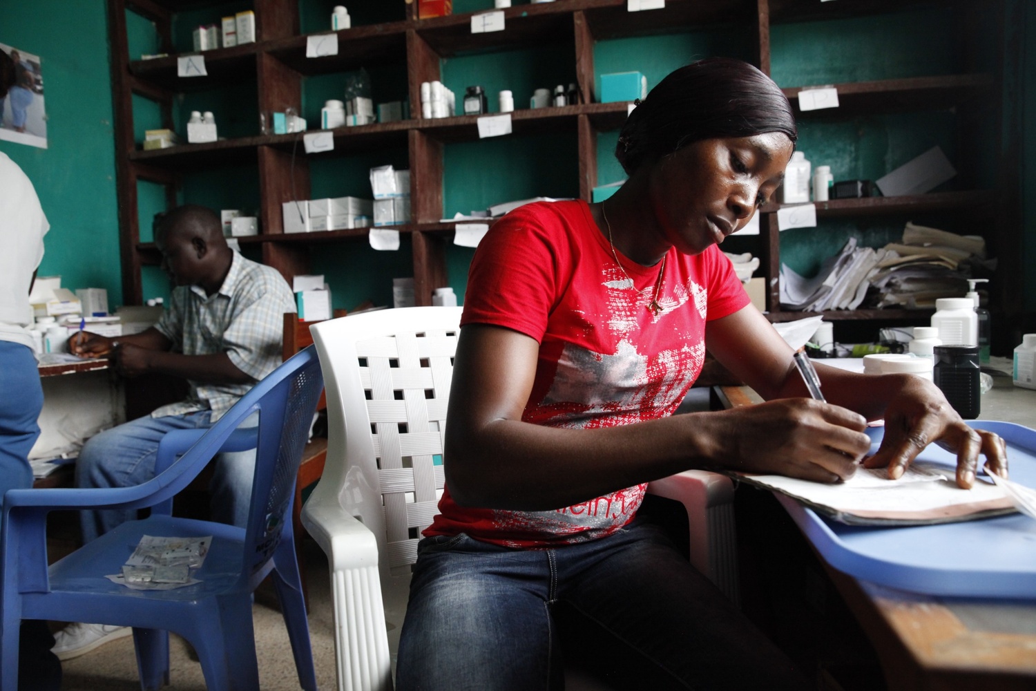 Registered Nurse works with patients and staff members in Liberia