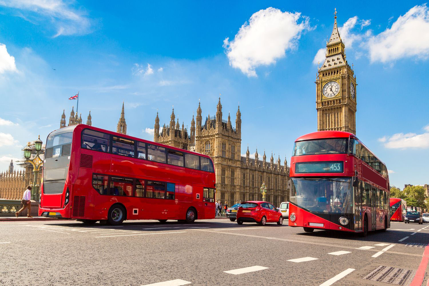 Image of Westminster Bridge and red buses in London 
