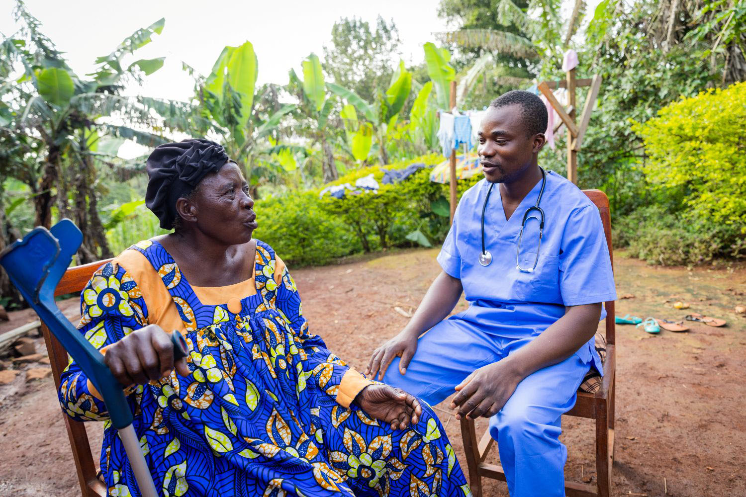 A doctor attending to an elderly woman