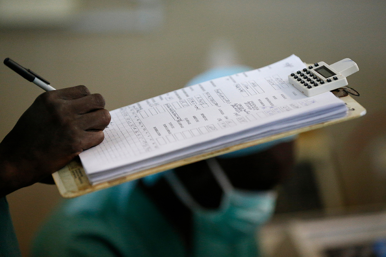 Health care worker collects data in hospital setting in Africa