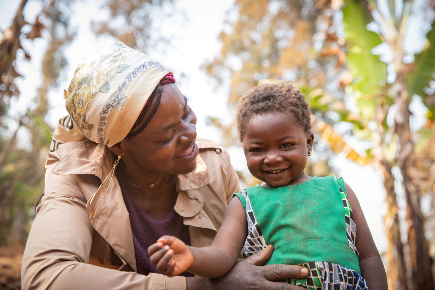 Image of mother and daughter smiling.