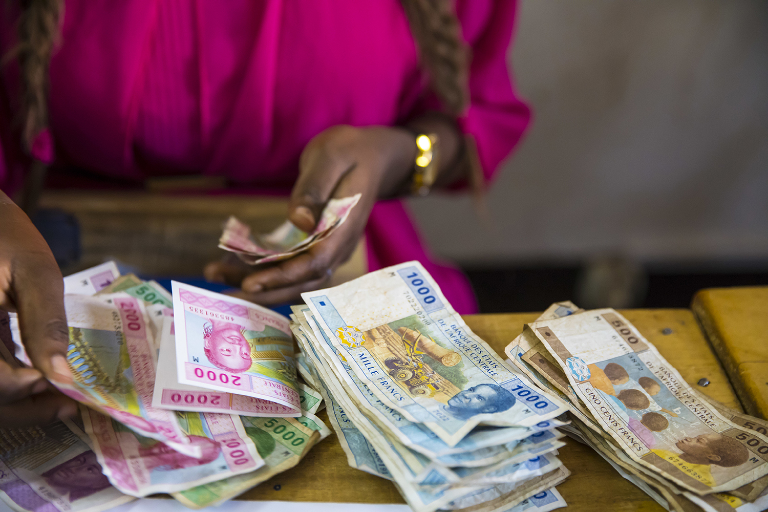 Woman holding money, Bangui, CAR