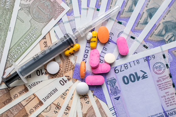 An image of Indian bank notes, and medicine