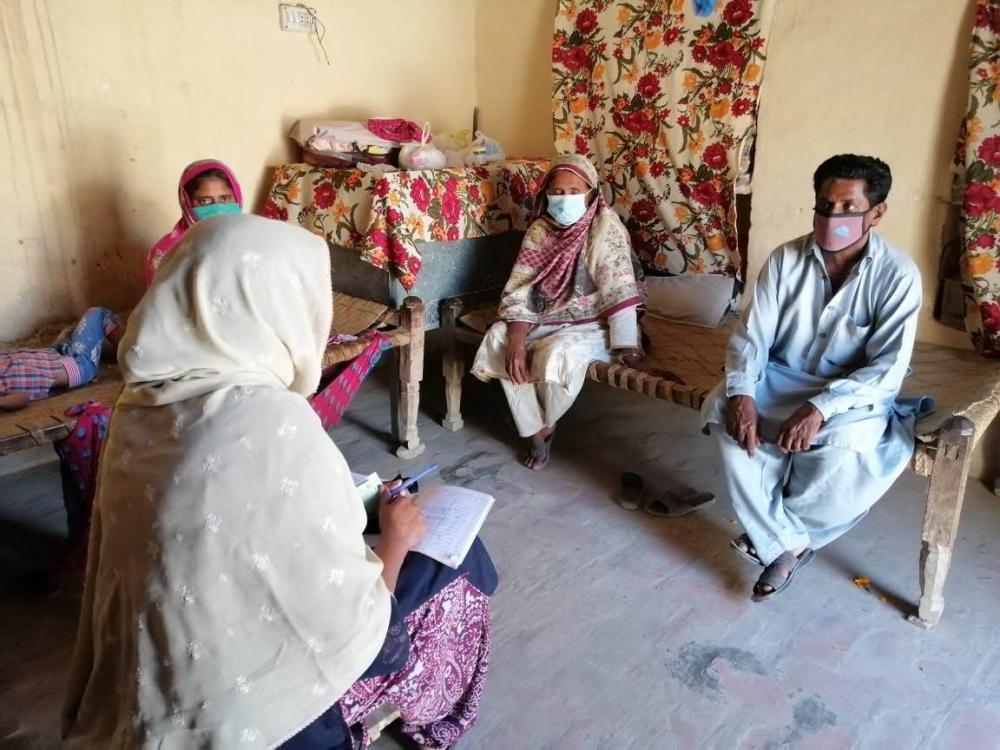 A TCF surveyor in a village in Pakistan.
