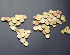 An image of the world made out of coins.